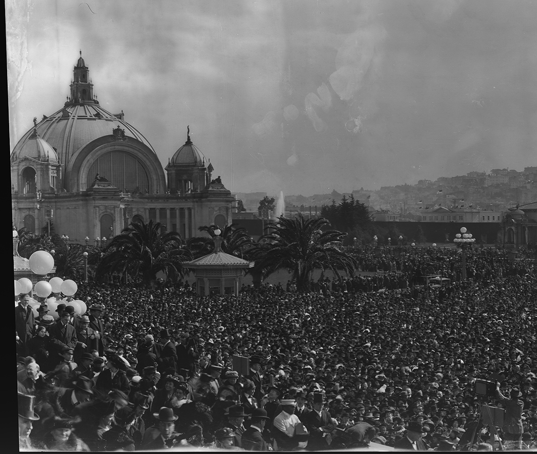 Detail of left portion of panoramic photo: crowd scene while "Turning on the Fountain of Energy, Opening Day"