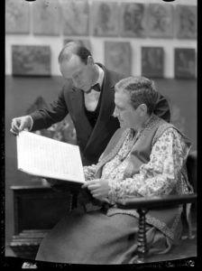 Gertrude Stein and Virgil Thomson looking at a musical score.