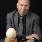 picture of Ian next to large egg