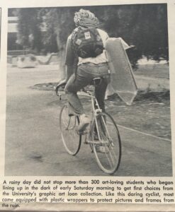 Student riding bike with GALC print