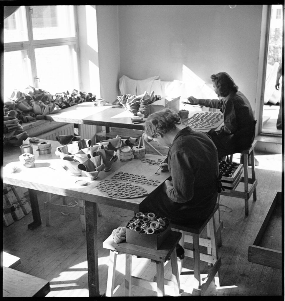 Women work in a gas mask factory. BANC PIC 1982.111: box 14, item 874